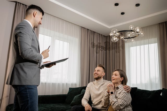A landlord speaking with two prospective tenants